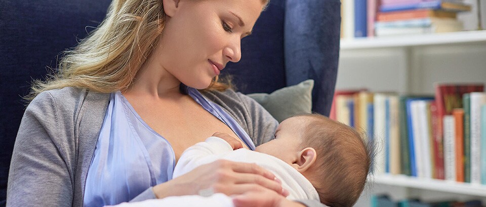 Mother breastfeeding baby