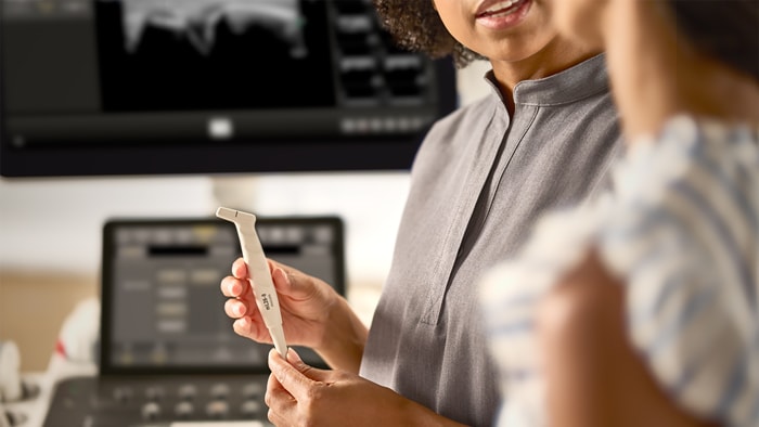 Healthcare practitioners holding the Philips Epic Ultrasound Transducer.  