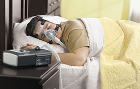 Patient using sleep therapy components